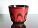 Vintage planter, red with brown swirl decoration
